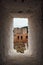 Walls of the fortress of the Alcazaba seen through the window of the candle tower, Alhambra, Granada.