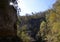 Walls of Jericho Landscape with Sun Behind Shadowed Wall