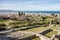 The walls of the medieval Patras Castle in Greece at sunrise with the city