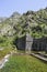 Walls old fortress of Kotor abruptly climbing uphill. Kotor, Montenegro