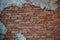 Walls of old red brick. The wall texture. With pieces smeared putty. Showered
