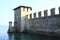 Walls and tower in lake on Castle Castello di Sirmione