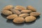 The walnut almonds handful close-up on a dark plate. Healthy and protein food