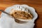 Walnut apple strudel dessert on white plate with fork and napkin