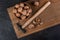 Walnut in a bowl and hammer on a wooden board