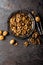 Walnut kernels and whole walnuts on rustic old table