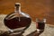 Walnut liquor in bottle on a wooden table