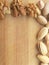 Walnut and pistachio border on wooden background