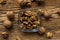 Walnut in a smale plate with scattered shelled nuts and whole nut which standing on a wooden vintage table. Walnuts is a