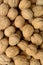 Walnuts background close up, pile of unshelled nuts. Top view.