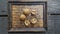 Walnuts on bamboo tray and wooden background.