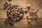 Walnuts and hazelnuts over wooden board