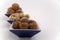 Walnuts, hazelnuts and peanuts in three bowls