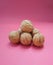 Walnuts Juglans regia on pink background close up