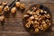 Walnuts. Kernels and whole nuts on wooden rustic table