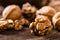 Walnuts. Kernels and whole nuts on wooden rustic table