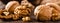 Walnuts. Kernels and whole nuts on wooden rustic table closeup, banner