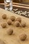 Walnuts on a light board and pumpkin seeds on a dark table. Glass of water. The rays of the sun on the table. Low calorie diet