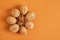 walnuts pattern on brown background, top view copy space