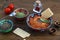 Walnuts and pepper dip sauce Muhammara and ingredients close-up on the table. horizontal