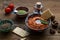 Walnuts and pepper dip sauce Muhammara and ingredients close-up on the table. horizontal