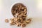 Walnuts Spilling Out Of A Container, Close Centered