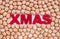 Walnuts surrounding the word Xmas written in red letters