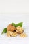 Walnuts walnut nuts nut nutshell portrait format copyspace on wooden board