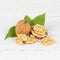 Walnuts walnut nuts nut nutshell square on wooden board