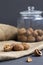 Walnuts. walnuts in shells on a black table and in a glass jar