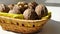 Walnuts whole and cracked in old baskets. Close-up, healthy food with rustic background