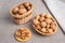 Walnuts in a wicker basket, peeled kernels