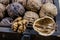 Walnuts on a wooden kitchen table. Nuts and a black wooden crate