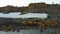 Walruses and people environmentalists on coast of Arctic Ocean copter aero view.