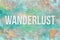 Wanderlust, travel & vacation conceptual words with colored & embossed abstract overlapping square.