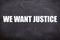 We want justice text with blackboard background.