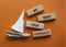 We want your feedback symbol. Wooden blocks with words We want your feedback. Beautiful orange background with boat. We want your