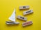 We want your feedback symbol. Wooden blocks with words We want your feedback. Beautiful yellow background with boat. We want your
