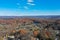 Wantage NJ and Lake Neepaulin on a sunny autumn day with fall foliage aerial