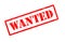 Wanted text rubber seal stamp watermark.