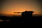 War Concept. Armored vehicle silhouette fighting scene on war fog sky background. American tank at sunset