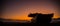 War Concept. Armored vehicle silhouette fighting scene on war fog sky background. American tank at sunset