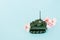 War machine with a flower in the back, peace and war, military action, a flower in the barrel of a tank, a concept on the army,