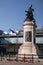 War Memorial bronze statue on stone plinth with poppy wreaths in Old Eldon Square Newcastle upon Tyne