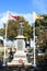 War memorial statue Carnforth with flags flying