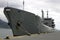 War ship in harbor tied by the dock