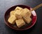 Warabi mochi placed on a black Japanese tray