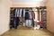 Wardrobe full of different men and woman clothes