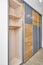 Wardrobe with LED lighting, sliding doors and inner case of light laminated particle boards