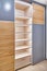 Wardrobe with LED lighting, sliding doors and inner case of light laminated particle boards